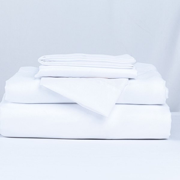 Stack of folded white bed linen